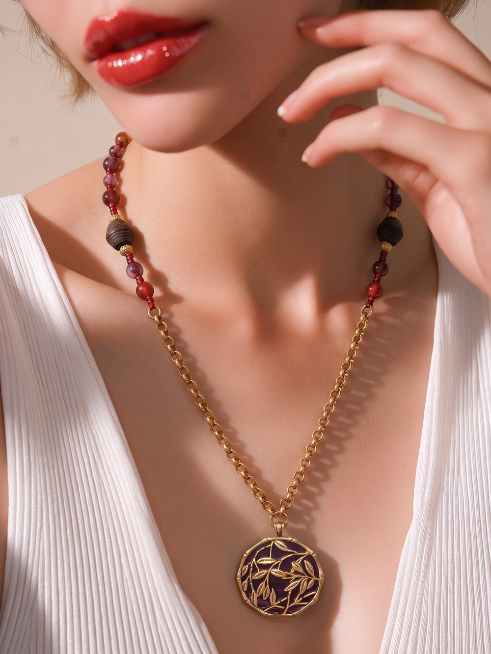Lucky Brand gold-tone pendant necklace with burgundy bead accents
